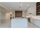 Gourmet kitchen featuring island with quartz countertop, and stainless steel appliances at 3145 E Boot Track Trl, Gilbert, AZ 85296