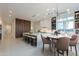 Bright, modern kitchen features large island with seating and stylish light fixture at 3145 E Boot Track Trl, Gilbert, AZ 85296