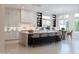 Well-lit kitchen with a large island, barstool seating, modern appliances, and ample counter space at 3145 E Boot Track Trl, Gilbert, AZ 85296