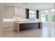 Open-concept kitchen featuring stainless steel appliances and a large center island at 3145 E Boot Track Trl, Gilbert, AZ 85296