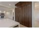 Spacious kitchen featuring island with quartz countertop and modern wood cabinetry at 3145 E Boot Track Trl, Gilbert, AZ 85296