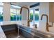 Kitchen sink with a large single basin, white countertop, and bright window view at 3145 E Boot Track Trl, Gilbert, AZ 85296