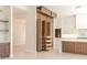 Modern kitchen featuring custom wood cabinets with shelving, and ample storage, drawers open at 3145 E Boot Track Trl, Gilbert, AZ 85296