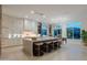 Large kitchen with oversized island, modern stools, stainless steel appliances, and eat in nook at 3145 E Boot Track Trl, Gilbert, AZ 85296