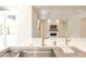 Kitchen with double sink and stainless steel fixtures, in an open concept space at 3145 E Boot Track Trl, Gilbert, AZ 85296