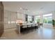 Bright kitchen boasts an oversized island with seating, modern cabinetry, and windows allowing natural light at 3145 E Boot Track Trl, Gilbert, AZ 85296