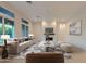 Bright living room with modern decor, a fireplace, and comfortable seating arrangement with natural light at 3145 E Boot Track Trl, Gilbert, AZ 85296