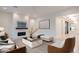 Bright living room with modern decor, fireplace, and ample seating at 3145 E Boot Track Trl, Gilbert, AZ 85296