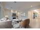 Neutral toned living room with stylish furniture, modern decor and an open floor plan at 3145 E Boot Track Trl, Gilbert, AZ 85296