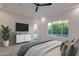 Modern main bedroom boasts a garden view, TV, and access to an outdoor space at 3145 E Boot Track Trl, Gilbert, AZ 85296