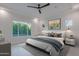 Serene main bedroom with large window, recessed lights, and stylish decor at 3145 E Boot Track Trl, Gilbert, AZ 85296