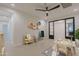 Spacious playroom featuring a table, shelving, and natural light from a large window at 3145 E Boot Track Trl, Gilbert, AZ 85296