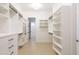 Spacious walk-in closet with custom shelving and drawers for organized storage at 3145 E Boot Track Trl, Gilbert, AZ 85296