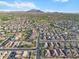 Expansive aerial view of a residential community with mountain views, showcasing the neighborhood layout and surrounding landscape at 3394 E Tiffany Ct, Gilbert, AZ 85298