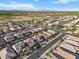 Wide aerial view of a residential neighborhood with beautiful mountain range in the background at 3394 E Tiffany Ct, Gilbert, AZ 85298