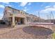 Backyard view showcases the home's exterior and patio area, complete with a trampoline at 3394 E Tiffany Ct, Gilbert, AZ 85298