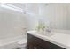 Bright, well-lit bathroom with a white countertop, dark wood vanity, and a shower-tub combo at 3394 E Tiffany Ct, Gilbert, AZ 85298
