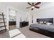 Open bedroom featuring neutral walls, plush carpet, a ceiling fan, with an ensuite bathroom at 3394 E Tiffany Ct, Gilbert, AZ 85298