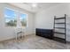 Bedroom featuring light walls, a ceiling fan, and a small vanity desk with stool at 3394 E Tiffany Ct, Gilbert, AZ 85298