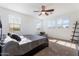 Bright bedroom with large windows, a ceiling fan, neutral decor, and carpeted flooring at 3394 E Tiffany Ct, Gilbert, AZ 85298