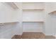 Walk-in closet with carpet and wooden racks for clothing and storage at 3394 E Tiffany Ct, Gilbert, AZ 85298