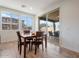 Bright breakfast nook with four-seater table and sliding glass doors opening to outdoor seating area at 3394 E Tiffany Ct, Gilbert, AZ 85298