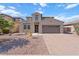 Charming home featuring a well-maintained desert landscape and a two-car garage at 3394 E Tiffany Ct, Gilbert, AZ 85298