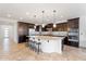 Modern kitchen with a large island, stainless steel appliances, and ample cabinet space at 3394 E Tiffany Ct, Gilbert, AZ 85298