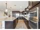 Modern kitchen featuring an island, stainless steel appliances, and stylish pendant lights at 3394 E Tiffany Ct, Gilbert, AZ 85298