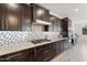 Well-appointed kitchen with stainless steel appliances and custom backsplash at 3394 E Tiffany Ct, Gilbert, AZ 85298