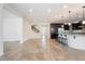 Inviting living area with open-concept layout, showcasing modern kitchen and staircase access at 3394 E Tiffany Ct, Gilbert, AZ 85298