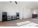 Open loft area featuring plush carpeting, neutral walls, modern ceiling fan, and black furniture at 3394 E Tiffany Ct, Gilbert, AZ 85298