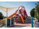 Modern playground with slides and climbing structures for children under a shade structure at 3394 E Tiffany Ct, Gilbert, AZ 85298