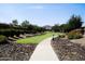Scenic walking path through the community with lush landscaping and mountain views at 3394 E Tiffany Ct, Gilbert, AZ 85298