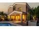 Inviting backyard featuring a sparkling swimming pool, covered patio, lush landscaping, and a two-story home at 3634 S Danielson Way, Chandler, AZ 85286