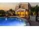 Enjoy the backyard with its swimming pool, covered patio, lush landscaping and outdoor seating area at 3634 S Danielson Way, Chandler, AZ 85286