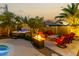 Relaxing backyard featuring a hot tub, fire pit, and comfortable seating area at 3634 S Danielson Way, Chandler, AZ 85286