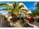 Backyard landscaping featuring a covered patio with desert landscaping with a beautiful mature tree at 3634 S Danielson Way, Chandler, AZ 85286