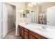 Bathroom featuring double sinks, neutral tile and a separate toilet room at 3634 S Danielson Way, Chandler, AZ 85286