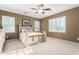 Serene bedroom with a large window, plantation shutters, neutral tones, and plush carpet, creating a peaceful retreat at 3634 S Danielson Way, Chandler, AZ 85286