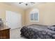 Bedroom with neutral tones, plush carpet, and a ceiling fan at 3634 S Danielson Way, Chandler, AZ 85286
