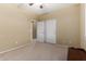 Bedroom featuring neutral carpet and a large closet with white doors at 3634 S Danielson Way, Chandler, AZ 85286