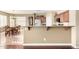 Open-concept kitchen with breakfast bar, dining area, and stainless steel appliances at 3634 S Danielson Way, Chandler, AZ 85286