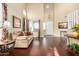 Elegant living room with high ceilings, hardwood floors, and abundant natural light at 3634 S Danielson Way, Chandler, AZ 85286