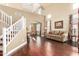 Spacious living room with staircase, hardwood floors, and bright, open layout at 3634 S Danielson Way, Chandler, AZ 85286