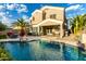 Home backyard and swimming pool featuring a covered patio and desert landscaping, perfect for outdoor living at 3634 S Danielson Way, Chandler, AZ 85286