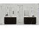Modern bathroom featuring dual vanities with dark cabinets, and a walk-in shower at 3738 E Gold Mountain Ave, San Tan Valley, AZ 85143
