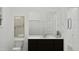 Modern bathroom with a dark vanity, bright mirror, and a walk-in shower at 3738 E Gold Mountain Ave, San Tan Valley, AZ 85143