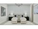 Serene bedroom with a king bed, two chairs, a modern chandelier, and a bright window at 3738 E Gold Mountain Ave, San Tan Valley, AZ 85143