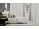 Relaxing bedroom featuring a soft bed, side table, modern lamps, and a large window at 3738 E Gold Mountain Ave, San Tan Valley, AZ 85143